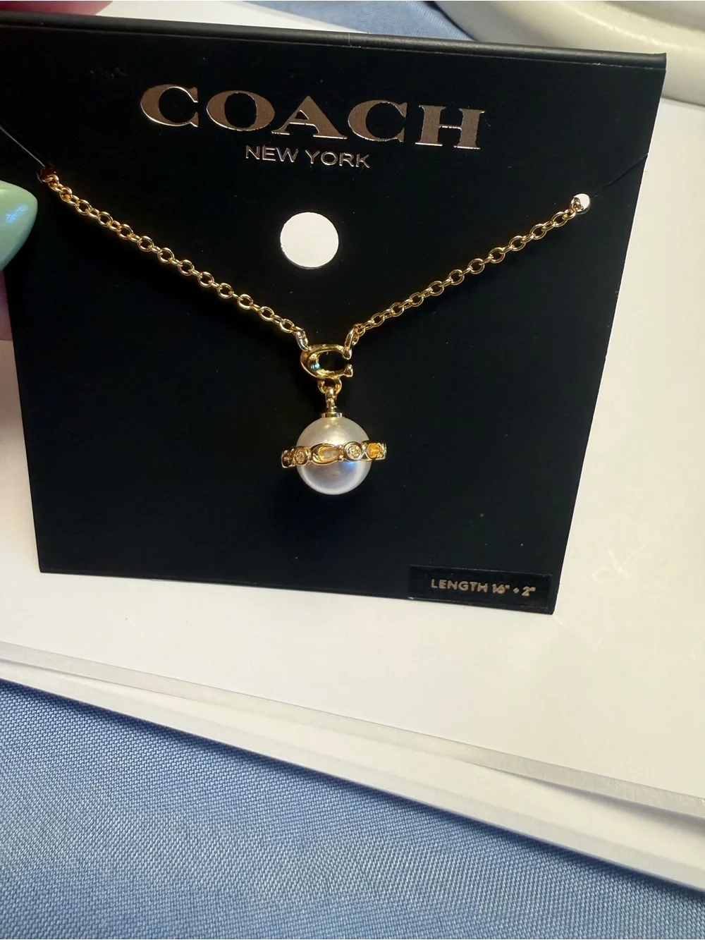 Coach Gold-Tone Pearl Pendant Necklace with Crystal Accents